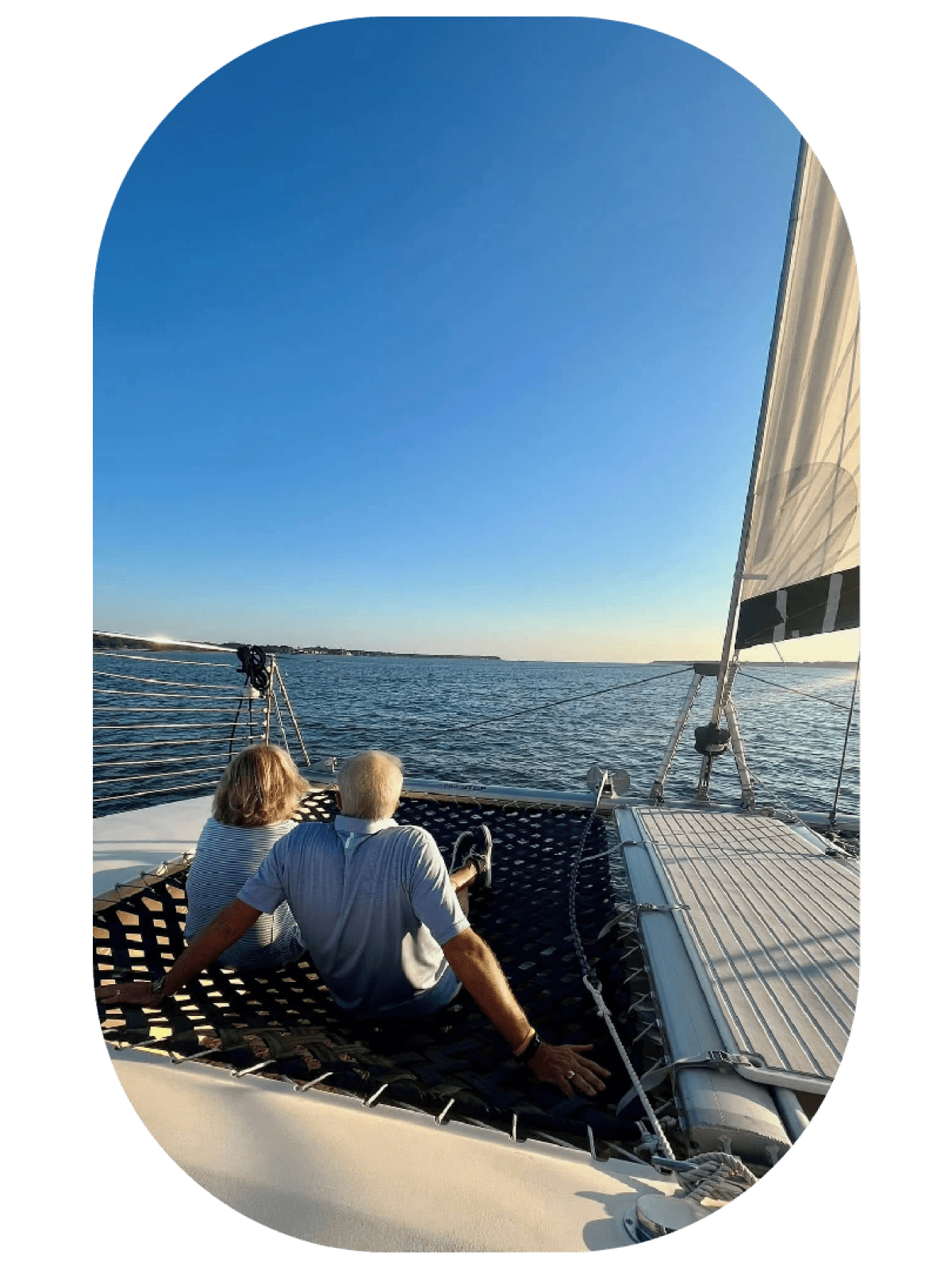a person sitting in a boat on a body of water