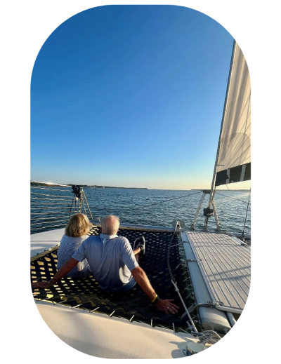 a person sitting in a boat on a body of water