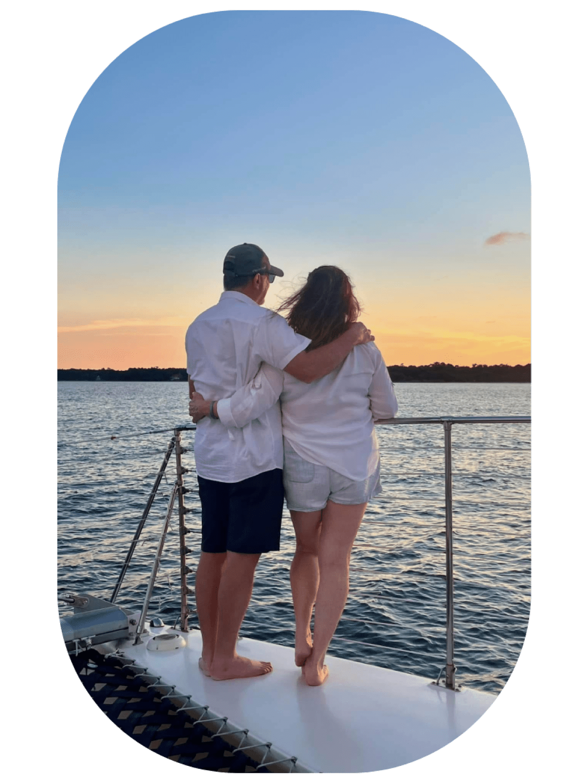 a man standing next to a body of water