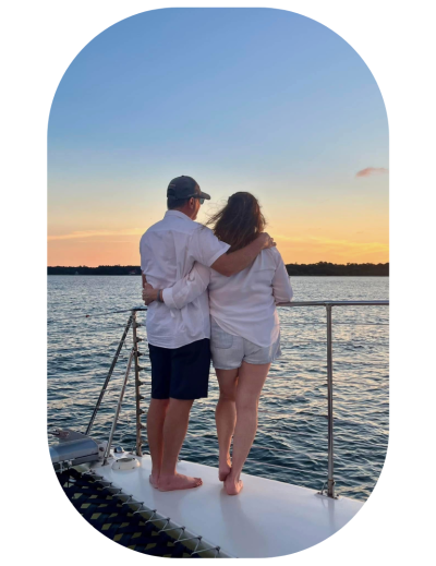 a man standing next to a body of water