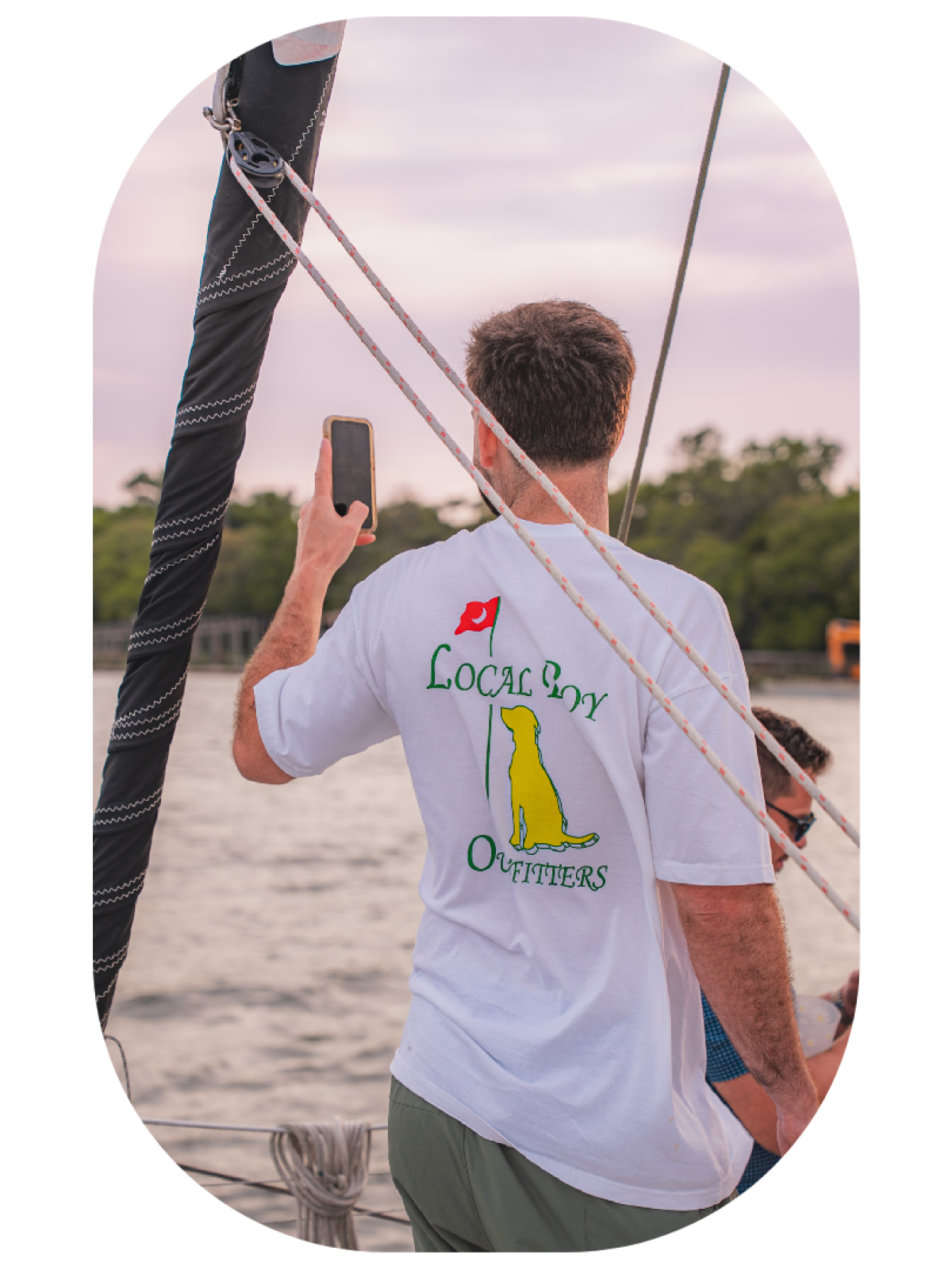 a close up of a man holding a kite
